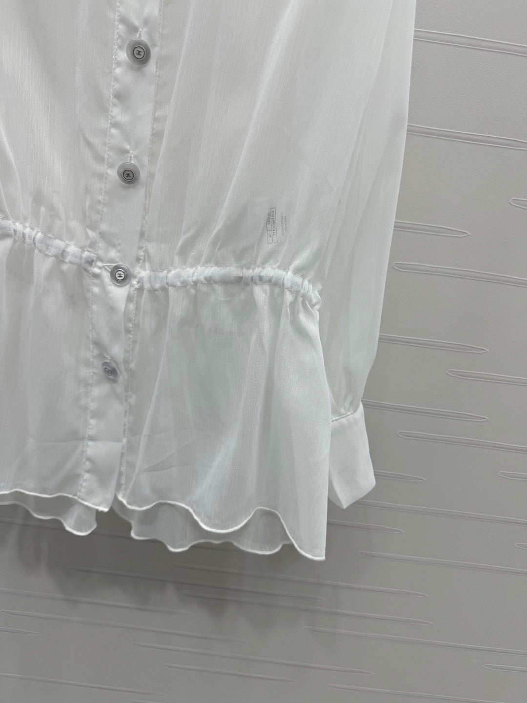 25 Ruffled long sleeved shirt