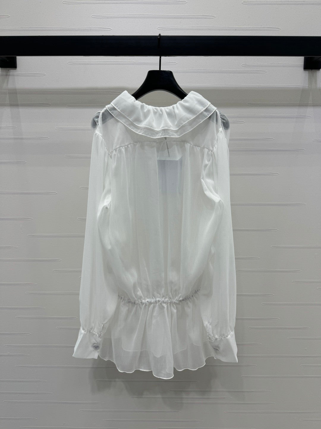 25  Ruffled long sleeved shirt